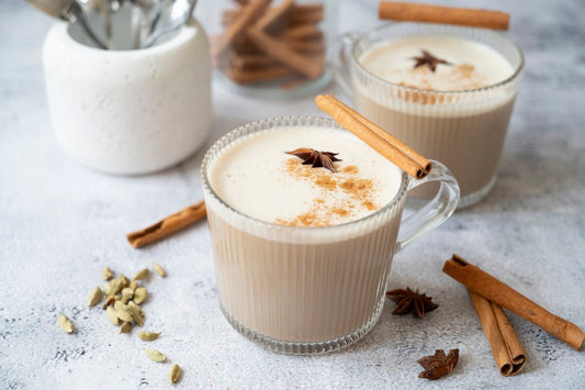 Vegan chai latte in a cup topped with cinnamon